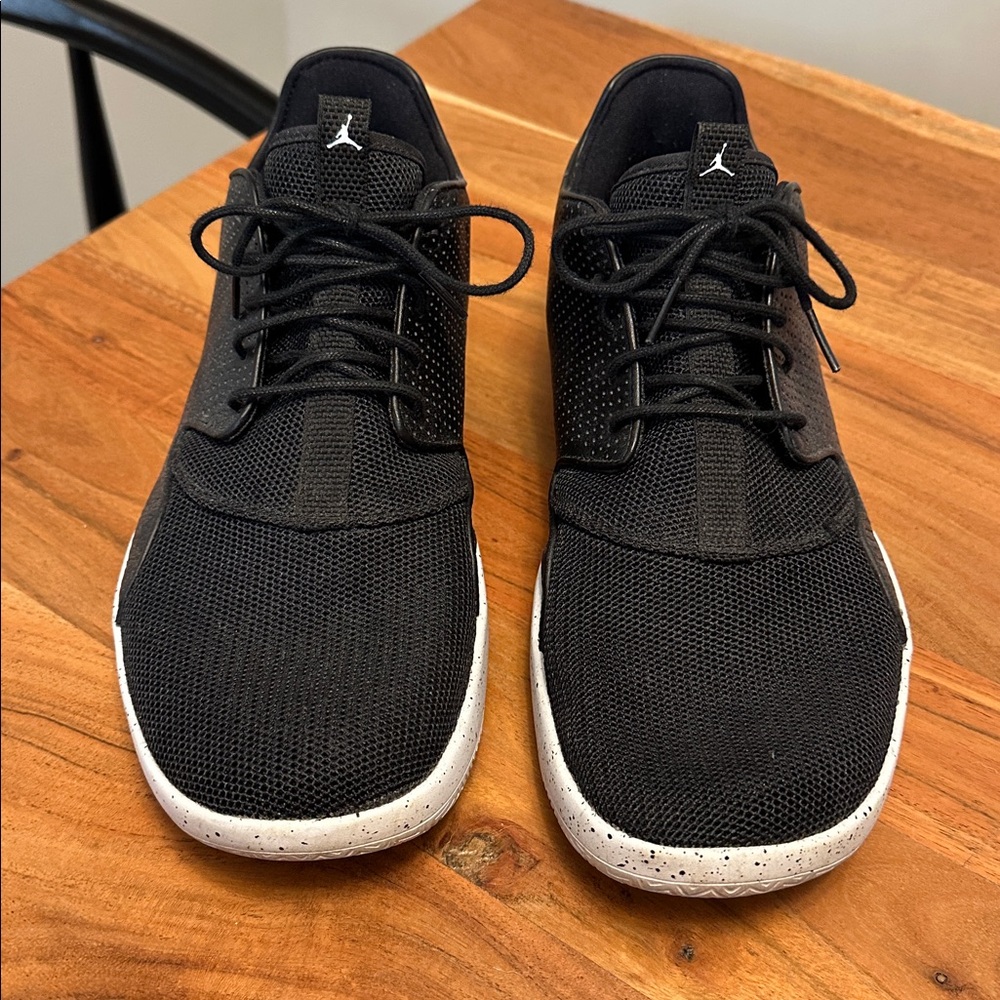 Air Jordan’s Black Athletic Sneakers with White Soles